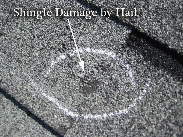 Close view of a shingle damaged by hail