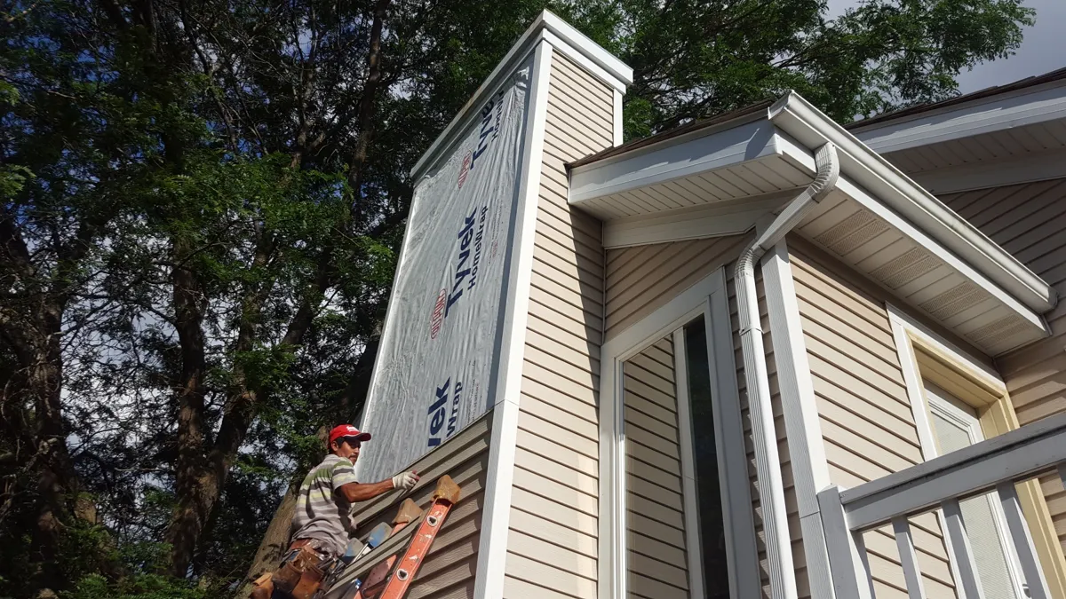 Steel siding installation in progress